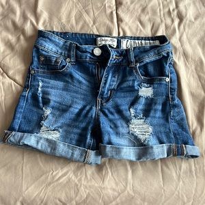 Cute ripped blue jean shorts from Indigo Rein